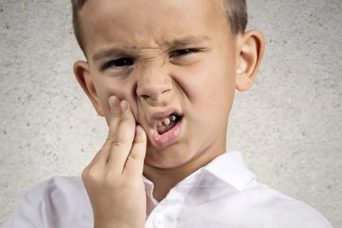 dentes de leite doem?